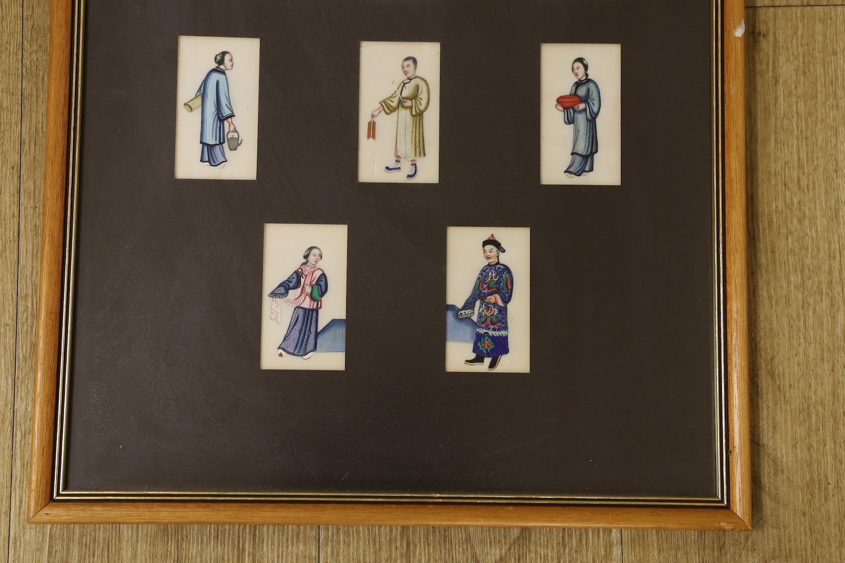 19th century Chinese School, seventeen gouaches on pith paper, Figure studies, 9 x 4.5cm, framed as one